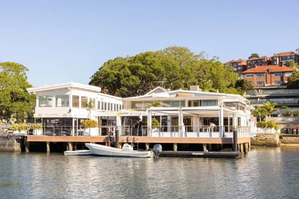 Rose Bay Marina waterfront building with a tender alongside