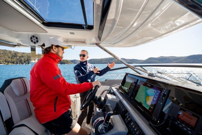 Boat instructor teaching how to dock a boat using throttle and steering controls