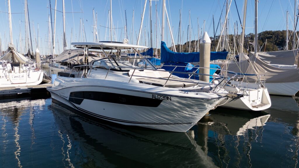 New boat owner motorboat docked at Sydney marina, practical boat training with BoatWise