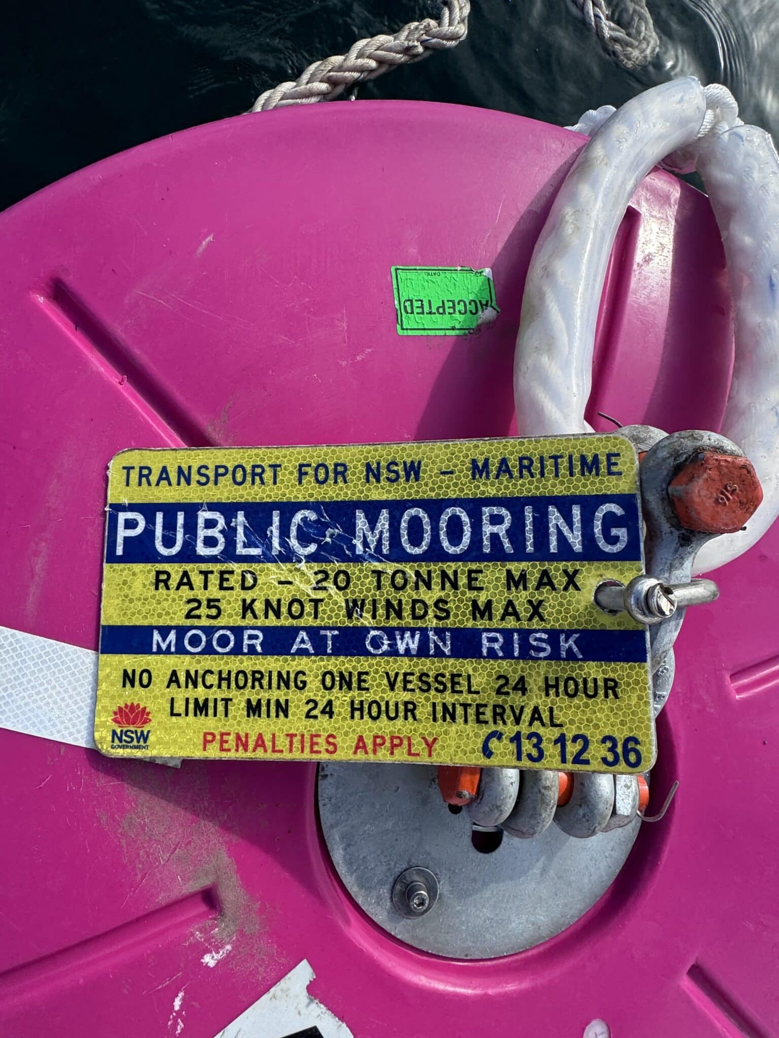 Transport for NSW pink public mooring buoy showing its 20 tonne, wind and 24-hour conditions