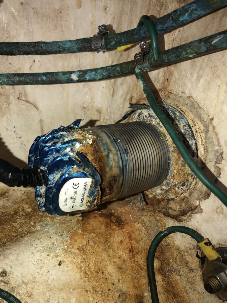 Severe corrosion around an underwater boat light and electrical cabling